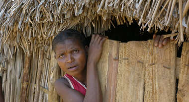 A woman looks out of the window.