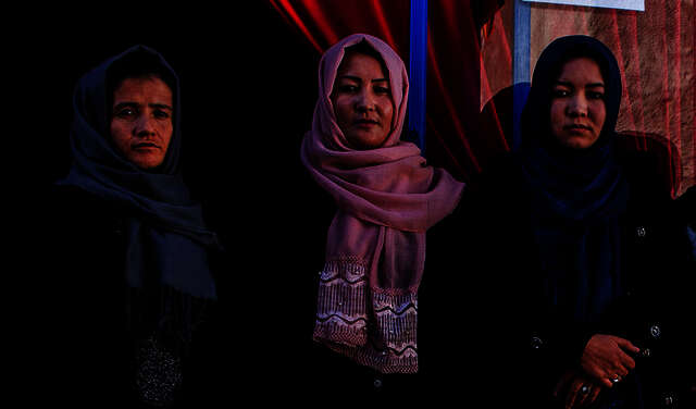 Graduates of Welthungerhilfe's vocational training programme in fron of their own business in Kabul