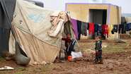 Two boys in a refugee camp in Idlib.