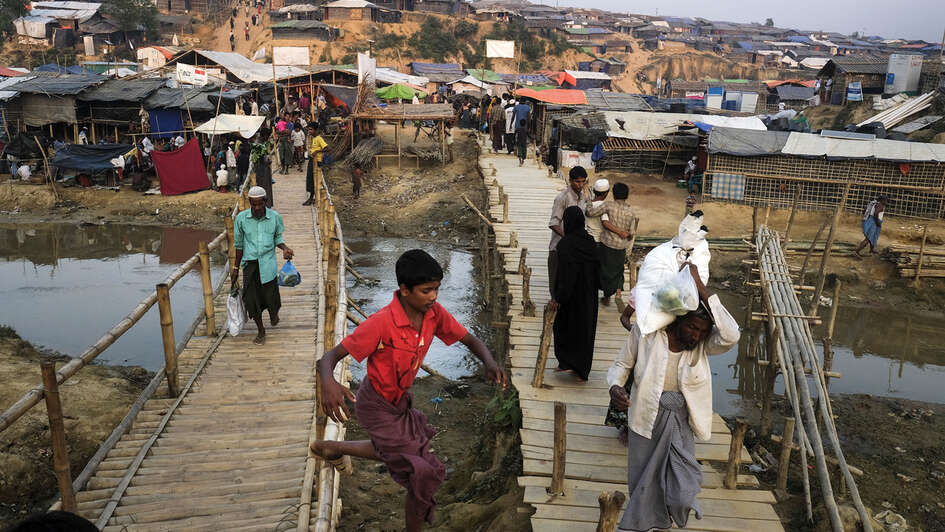 Two bamboo bridges leading over a river in the Kutupalong camp for Rohingya refugees in Bangladesh
