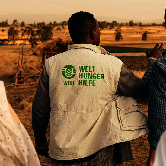 WHH staff member with branded jacket