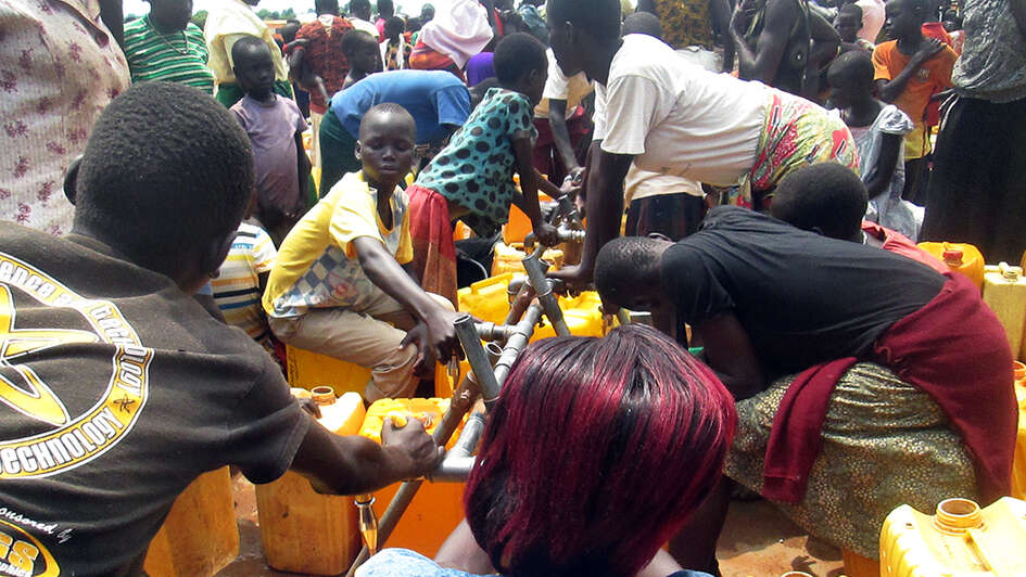 Refugees at a water point in the Bidibidi camp