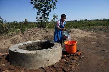 A student and member of the Wash-and Sanitation-Club at her school fetches water. A student and member of the Wash-and Sanitation-Club at her school fetches water.
