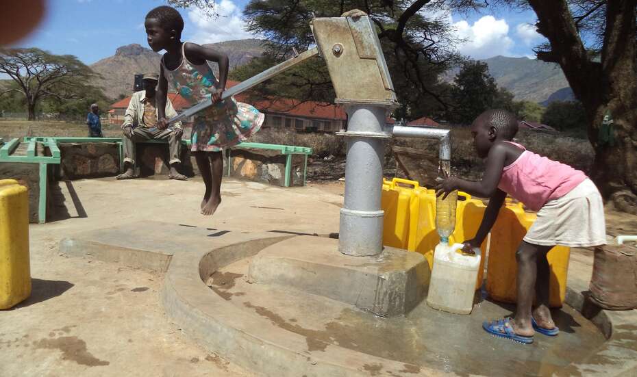 A brand-new drilled well in Moroto provides clean water. The new platform protects canisters from dirt, and the benches make the well a popular gathering place. A brand-new drilled well in Moroto provides clean water. The new platform protects canisters from dirt, and the benches make the well a popular gathering place.