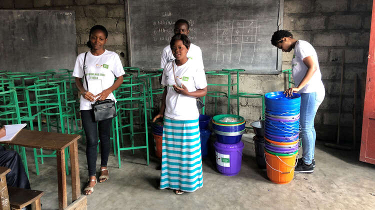 Welthungerhilfe staff with buckets and other handwashing equipment Welthungerhilfe staff with buckets and other handwashing equipment