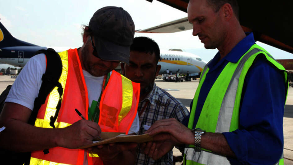 Emergency-worker Jürgen Mika signing some papers