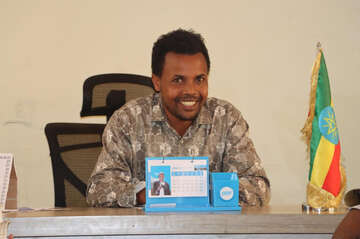 Man in uniform at an office desk